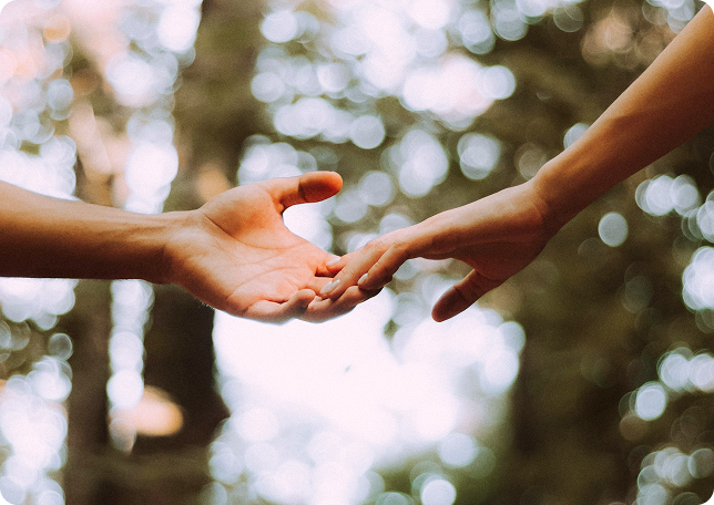 Two hands reaching toward each other